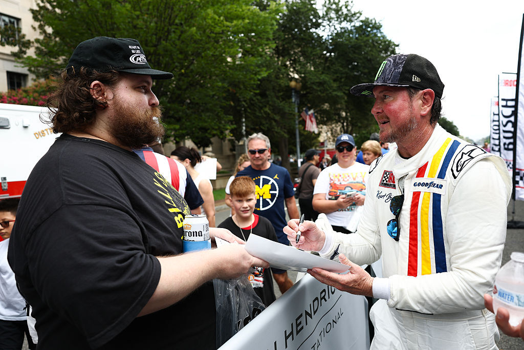 Kurt Busch signs autographs for fans