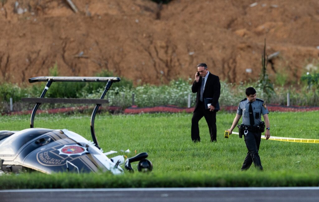 Investigators probe a dramatic midair crash as a landing plane hits  hovering police helicopter