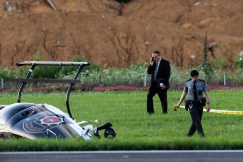Investigators probe a dramatic midair crash as a landing plane hits  hovering police helicopter