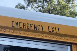 the words emergency exit seen up close on a school bus
