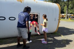 student exits from emergency exit on school bus