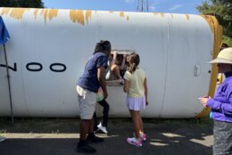 student exits from emergency exit on school bus