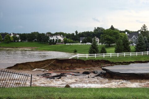 At least 6 people have died from days of storms and record-setting flooding in Indiana