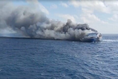 A blaze engulfs an Indonesian passenger ferry off Java, leaving at 5 dead and dozens missing