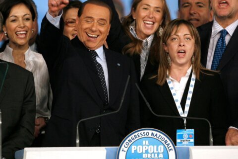 From black boots to pastel suits, Italian premier’s wardrobe evolves with her politics