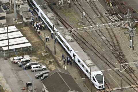 Express train hits and kills 4 workers at a railway station in Japan