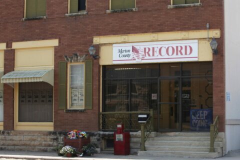 A Kansas town will pay $850K to end a reporter’s lawsuit over a 2023 raid on her paper’s offices