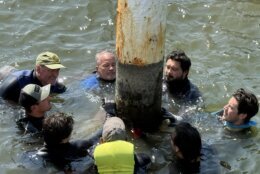 Guys in wetsuits in the water