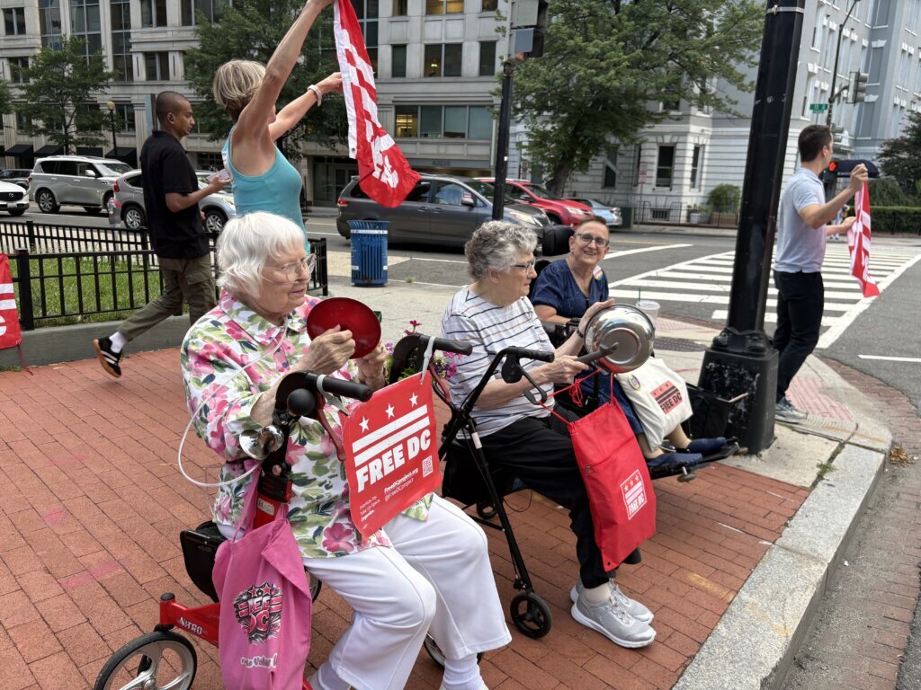 Why women in their 80s are making noise on a DC street corner every night
