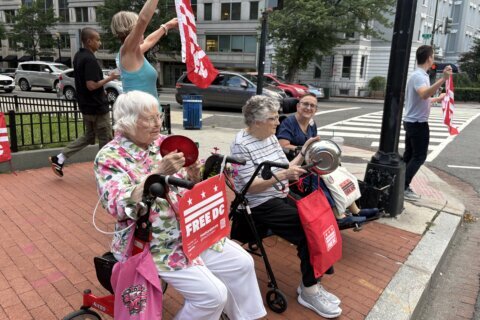Why women in their 80s are making noise on a DC street corner every night