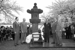 This is a photo featuring dignitaries from the presentation of a nearly 300-year-old Japanese Stone Lantern at the Tidal Basin in 1953, less than a decade after World War II.