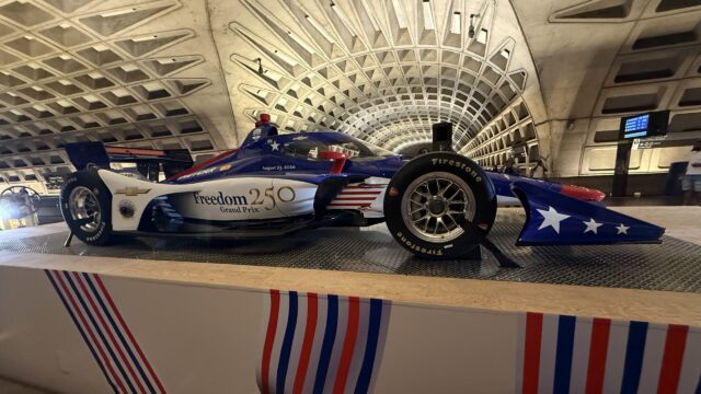 An IndyCar was pulled along the Metro tracks