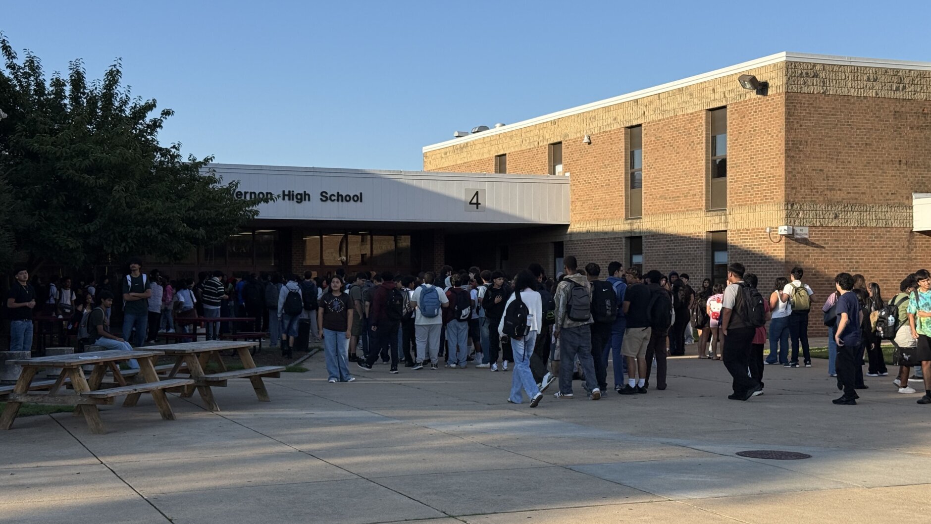 swarm of students outside in front of high school