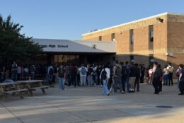 swarm of students outside in front of high school