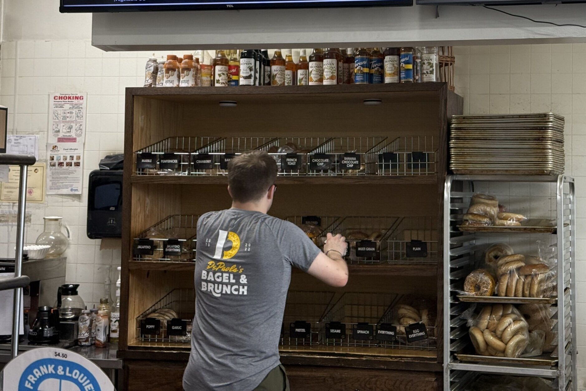 An employee at DePaola’s Bagel and Brunch