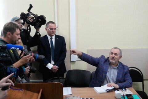 A Putin critic leaves Russia after he is barred him from running for parliament