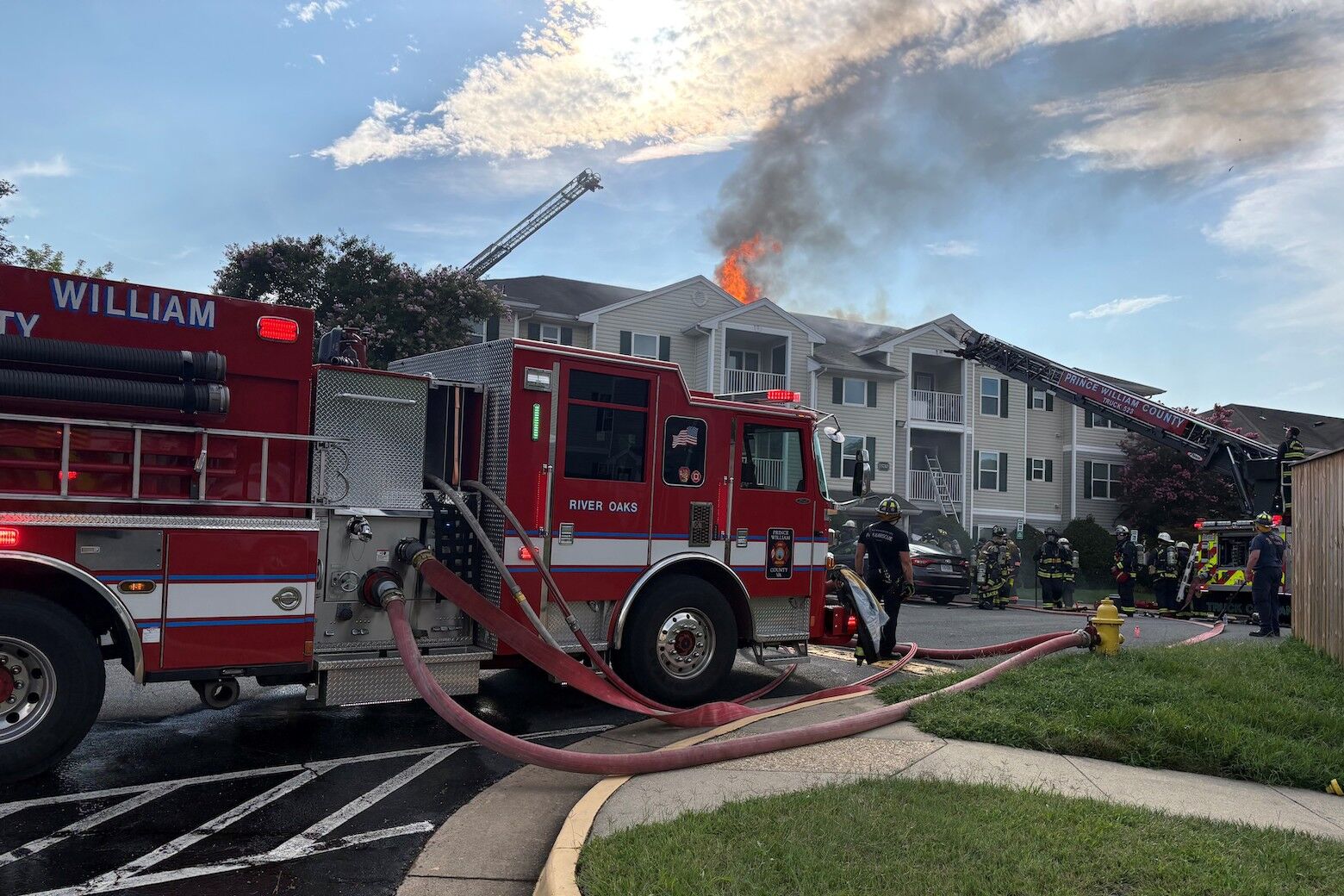 A three-alarm fire at a Woodbridge apartment building displaced 19 residents and injured two firefighters Saturday, officials said.
