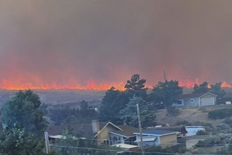 Wildfire approaches Reno, Nevada, forcing thousands to evacuate their neighborhoods