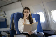 woman yawns on airplane
